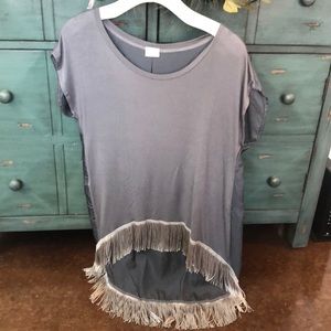 High-low teeshirt with fringe at the bottom.